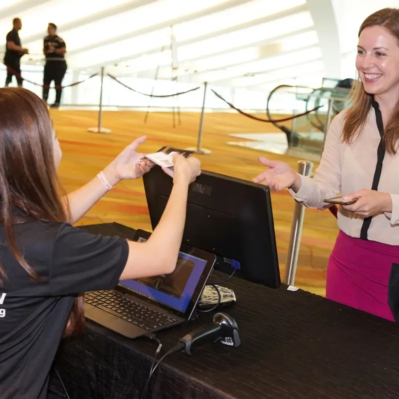 Digital Registration (2) - Event and Conference - DIgital Event Tools - The Project Crew Guest registering at a check-in counter by The Project Crew