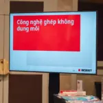 TV screens displaying BOBST content during conference session